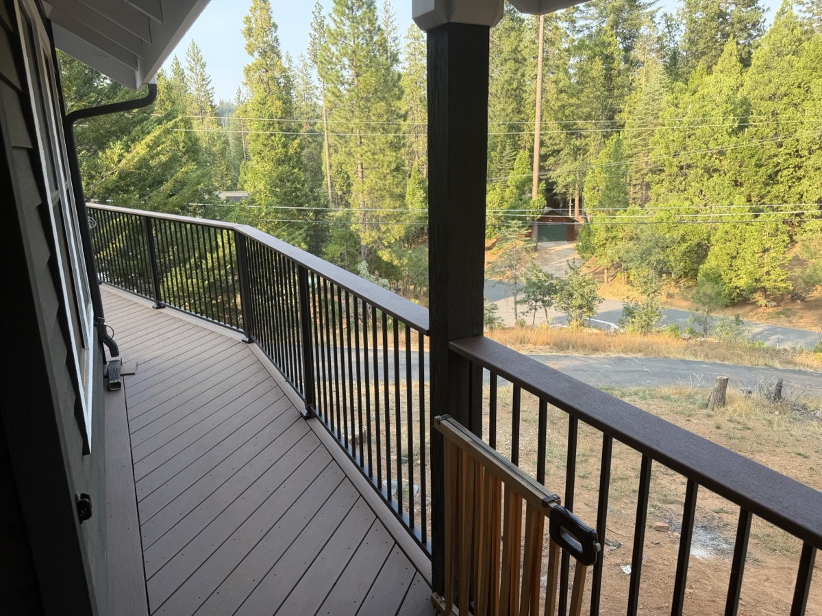 Dark Cinch picket railing along a deck overlooking the trees